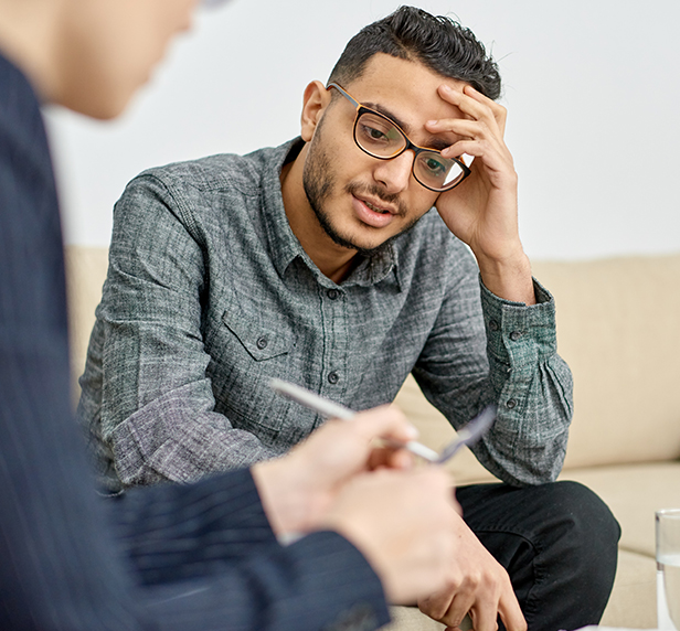 A young man discusses his anger management problems with his therapist.