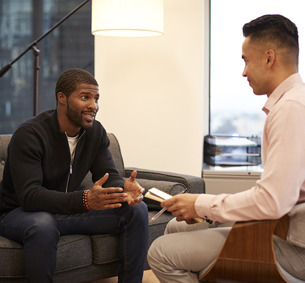A young man telling his therapist about his depression.