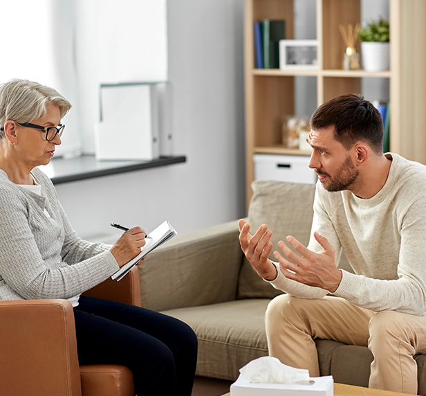 A man explaining Disruptive Mood Dysregulation Disorder to his therapist.