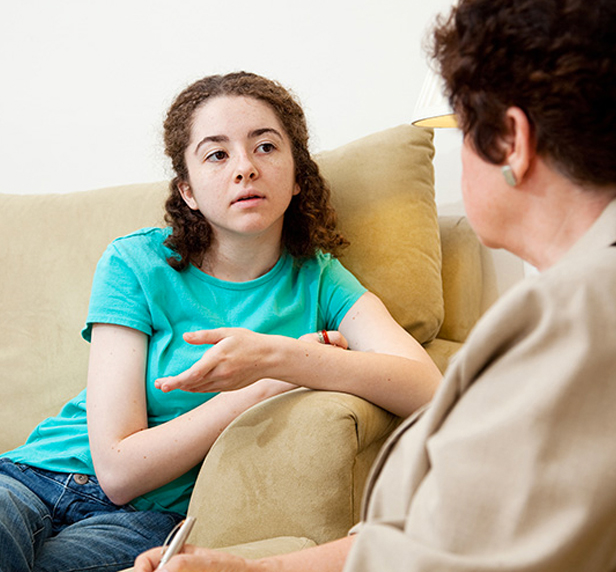 A child explains her feelings in family therapy.
