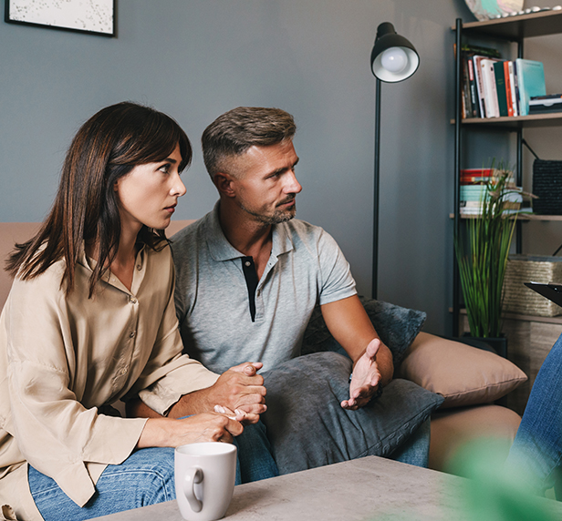 A couple contemplating why they should consider family therapy.