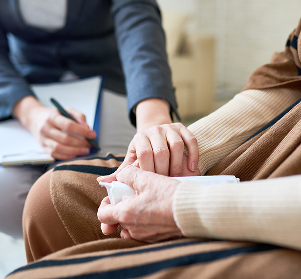 A therapist helping a patient cope with gried and loss.