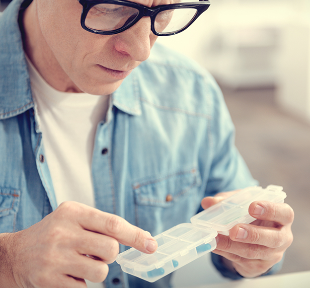 A man enjoys the benefits of medication management.