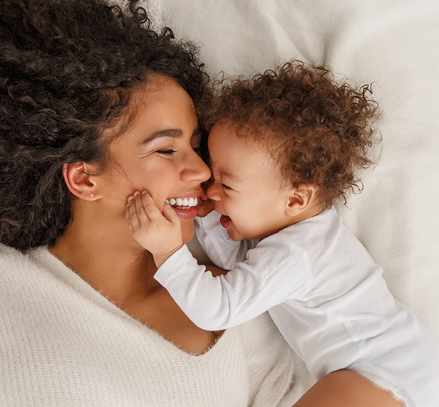 A mother with her newborn child. Happy, but still a victim of postpartum depression.