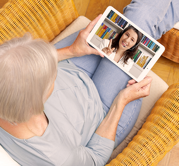 What is telepathy? This women has figured it out, as she sits with a tablet during her teletherapy session.